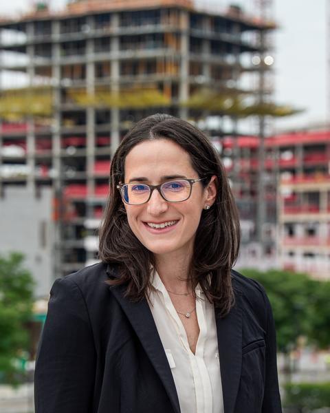 Photo of Jennifer Cohen standing in front of construction site